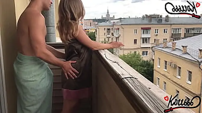 Sexy blonde takes standing doggystyle fuck on balcony