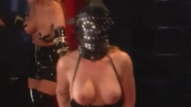 Kinky dominatrix uses sex toys on masked girl in latex suit