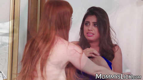 Redhead MILF seduces stepdaughter into lesbian threesome