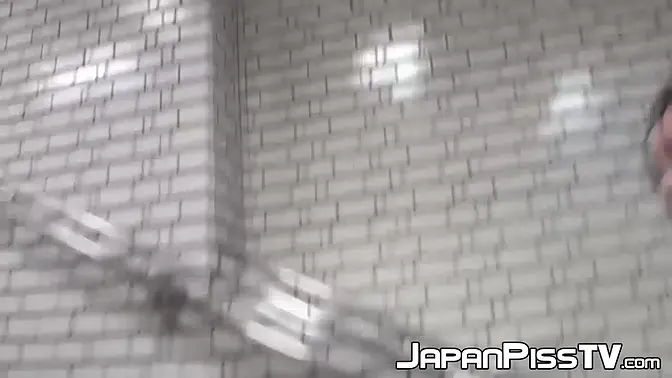 Asian babe pees in her skirt in public