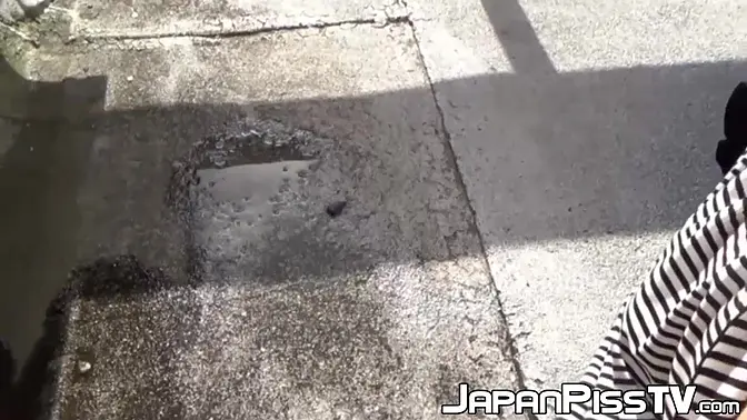 Redhead Japanese beauty plays with her wet pussy and pees