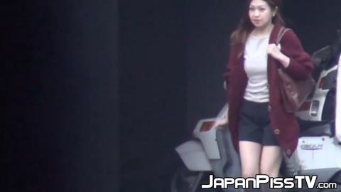 Naughty Japanese babe peeeing hard during broad day light
