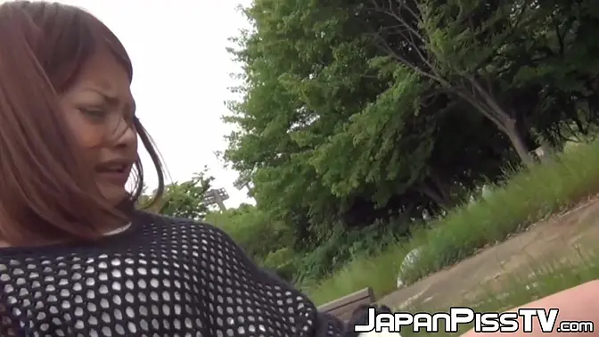 Hairy Asian babe pisses and rubs pussy in public playground