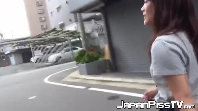 This shy girl needs to pee badly and brings a friend to record her while doing it outdoor