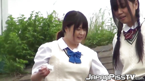 Outside pissing competition with two young Japanese pupils
