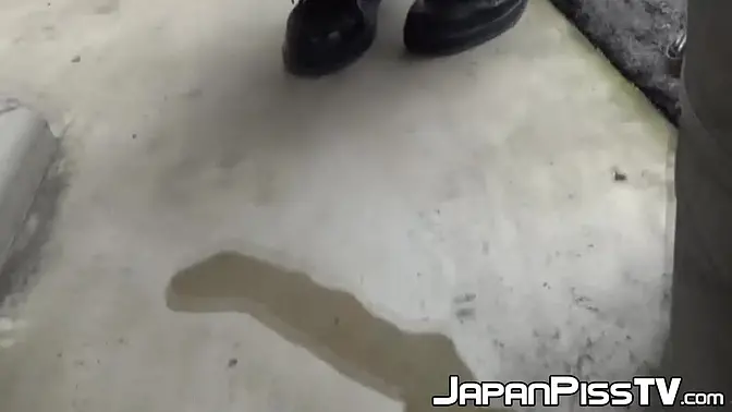 Young Asian redhead pees on the street