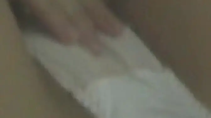 Asian beauty teases her wet cunt through lacy panties