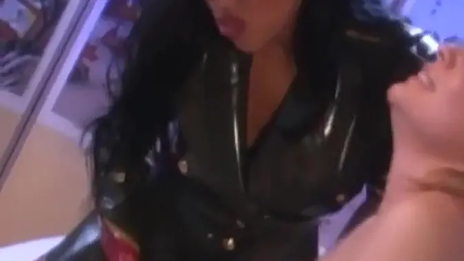 Blonde big tit dyke in latex suit takes a paddling from her leather-clad mistress