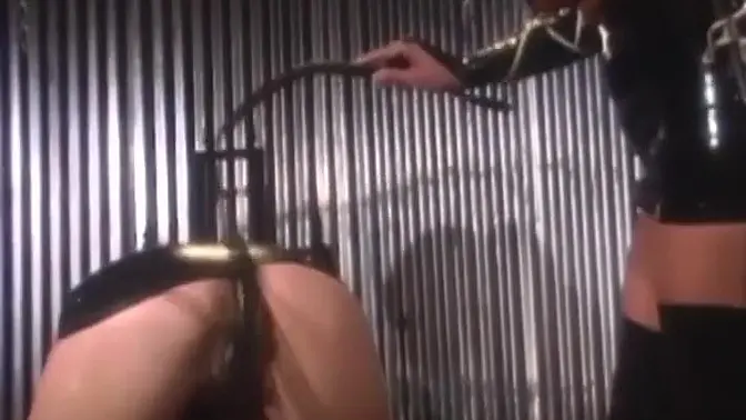 Blonde lesbo in latex suit gets spanked and toys herself