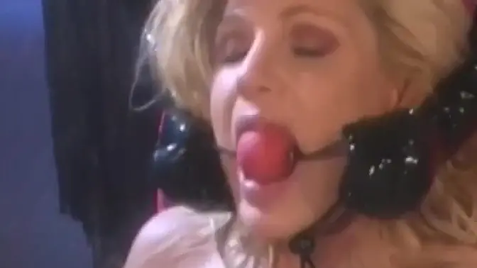 Blonde dyke in latex suit spreads legs for didlo and fingers