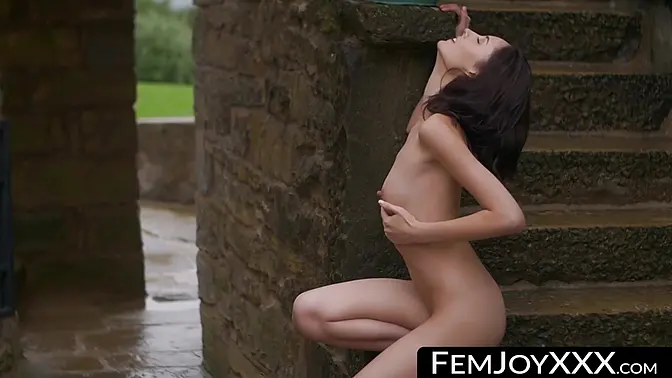 Stunning brunette Sabrina G teases with natural tits and shaved pussy outdoors