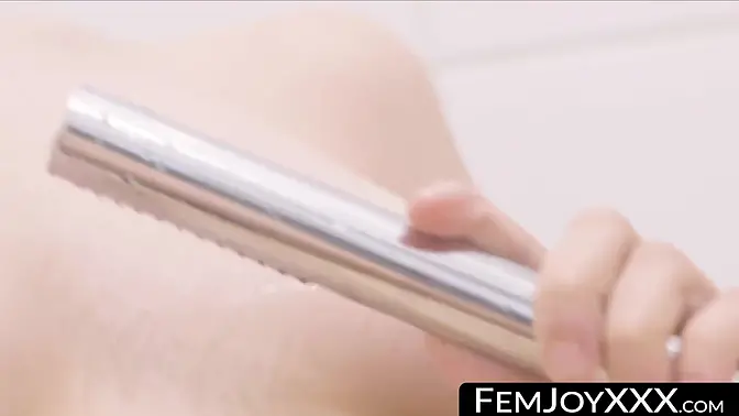 Brunette beauty teases her closely shaved pussy