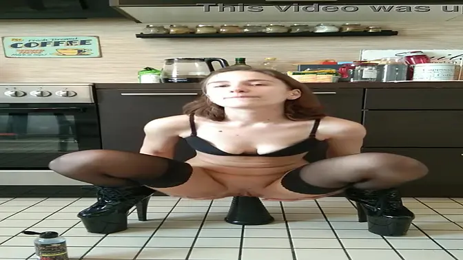 Cute amateur girl fisting and fucking her big pyramid sex toy in the kitchen