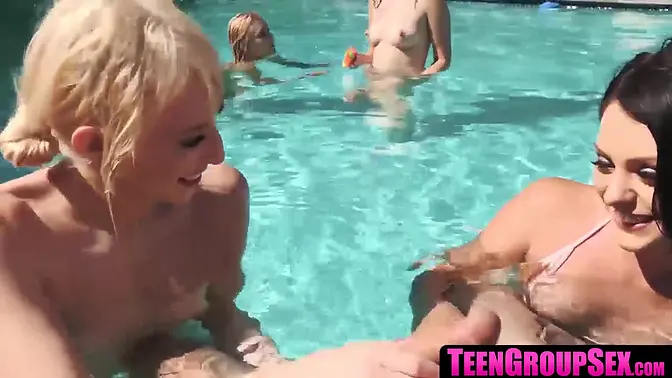 Sexy tattooed babe gets her small tits sucked and fucked in group pool action