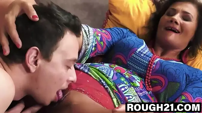 Brunette GILF deepthroats abig cock from a white hunk