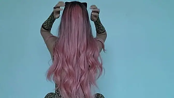 Pale-skinned girl tries on wild cat costume and shows off her assets