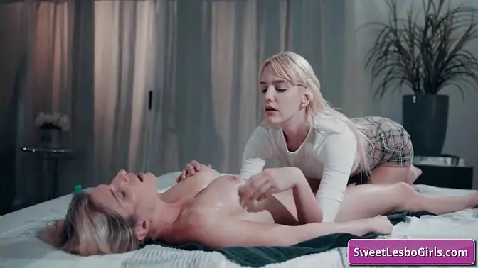 See this wet big boobed blondie lesbo seduced by her masseuse and enjoy strong orgasm