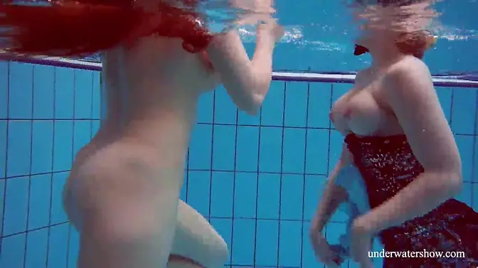 18yo brunette babe gets lesbo action in the pool