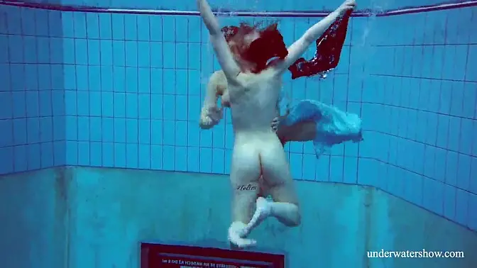 18yo brunette babe gets lesbo action in the pool