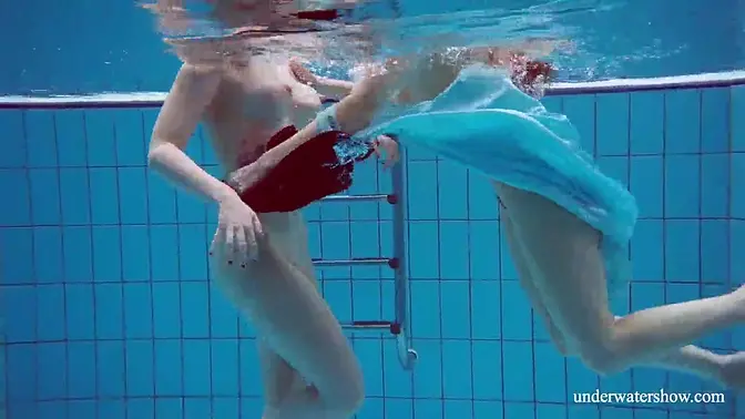 18yo brunette babe gets lesbo action in the pool