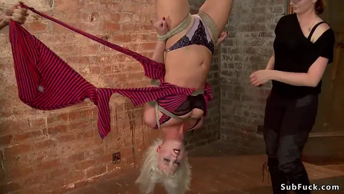 Blonde slave Cherry Torn takes a flogging upside down