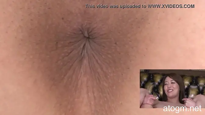 Asian girl spreads cheeks for close-up anal pleasure