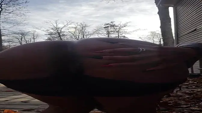 Black girl pees outside, shows wet sock