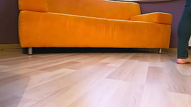 Barefoot babe tries on high heels and shows off her feet