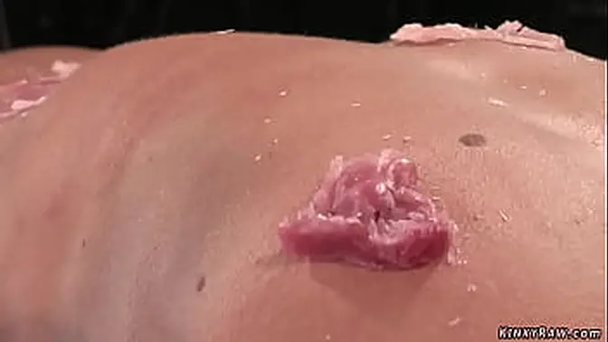 Bound brunette slave Cecilia Vega gets caned and waxed in the dungeon