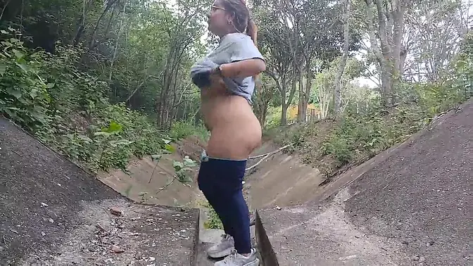 Busty Latina babe shows off her giant tits and huge ass outdoors