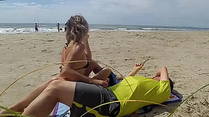 Beach MILF gives big cock handjob and cums with it