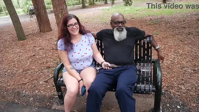 Glasses-wearing MILF strokes and sucks big black dong in public