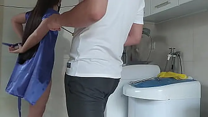 Housewife teasing the technician who came to fix the washing machine