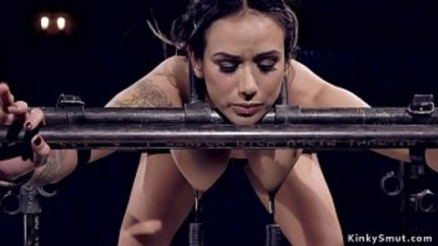 Hot big tits brunette sub bent over bound in metal device with nipples clamped and weighted