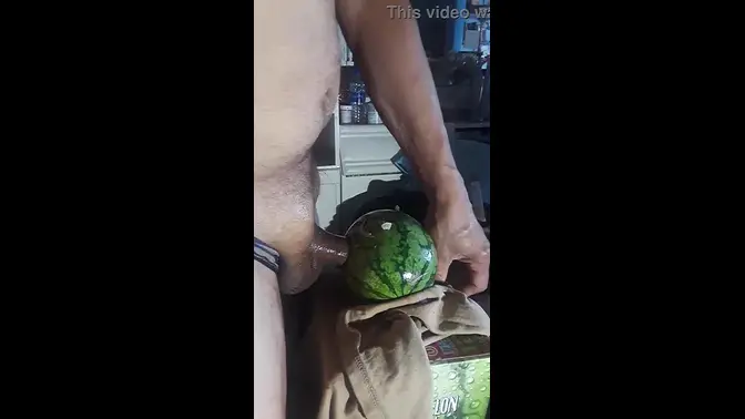 Solo guy strokes his cock to a fetish video