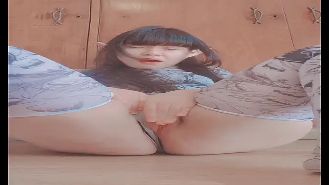 Young woman massaging pussy through panties