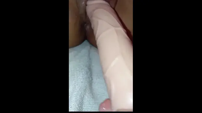 Amateur couple's intimate moment with dildo and vibrator