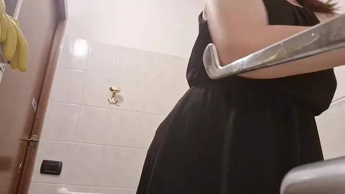 Italian MILF laughs awkwardly in public restroom