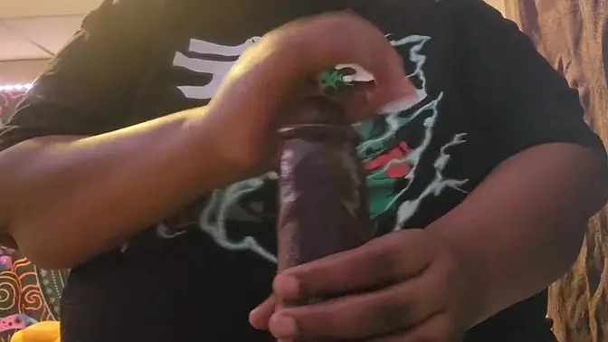 Chubby Black Woman Wearing T-Shirt Sucks Big Dildo