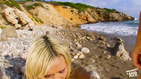 This blonde bombshell ravishes her helplessness on a deserted shore.