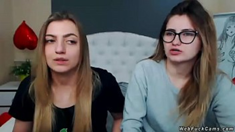 Two brunette amateur teen lesbian hotties stripping and tying in bed then licking in their private live webcam show on homemade footage