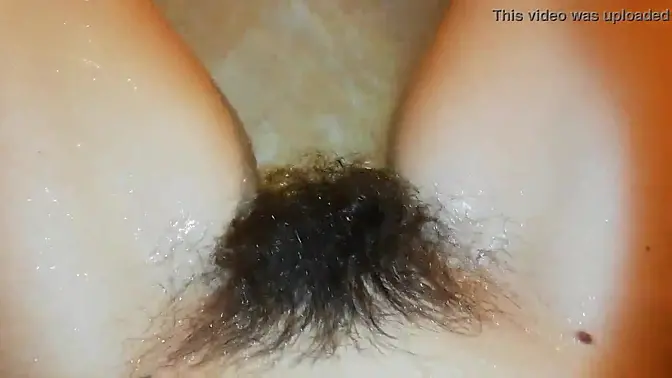 Amateur model showcases her hairy bush in close-up