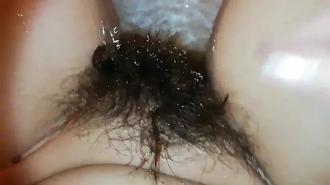 Amateur model showcases her hairy bush in close-up