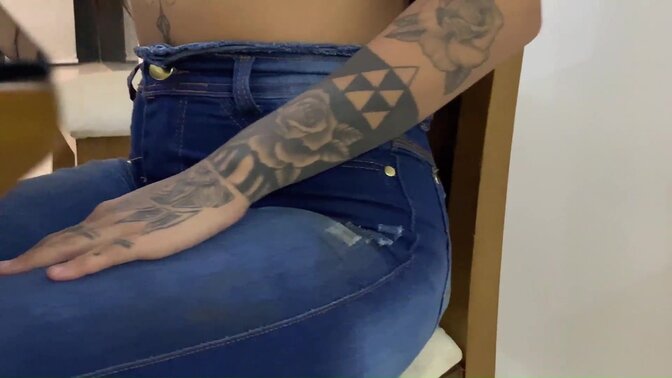 Naughty Latina with chest piercing shows off her tattoos while getting