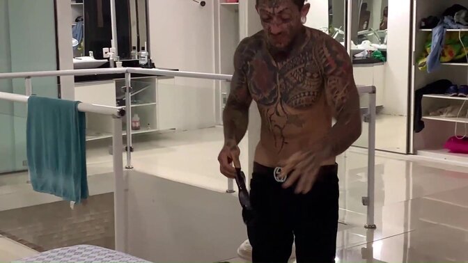 Naughty Latina with chest piercing shows off her tattoos while getting