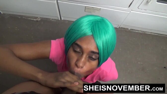 Cute young ebony girl gets a POV blowjob on her knees at the laundromat