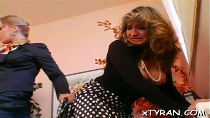 Mistresses tie up slave for BDSM playtime