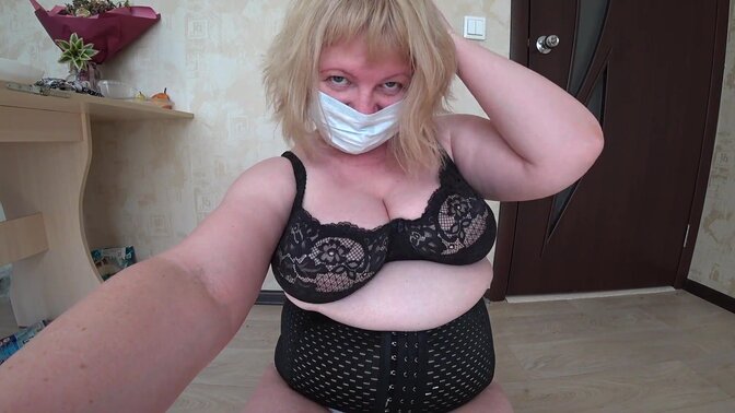 Mature Russian older woman with thick boobs and a big butt pees in her white panties.