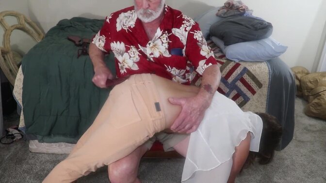 Petite MILF gives a hand spanking and paddle spanking to her husband