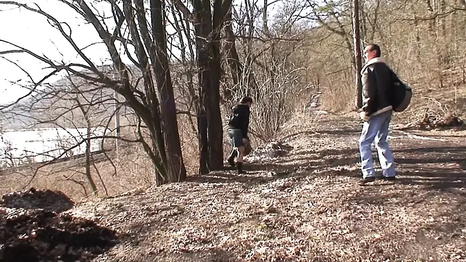 A charming German teenie pleasing a cougar schlong in the woods